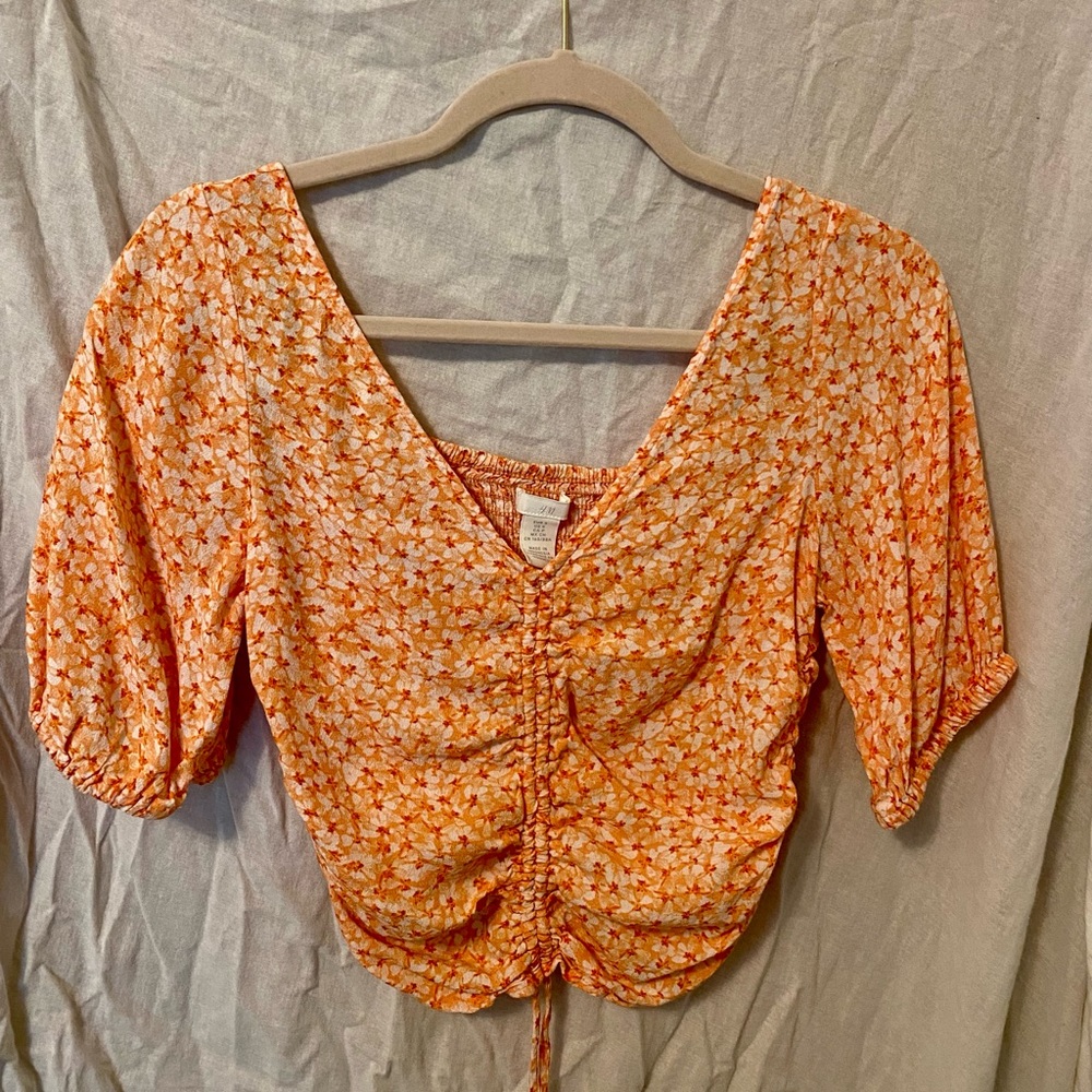 orange floral blouse!